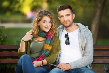Fototapeta premium Young couple in park hugging
