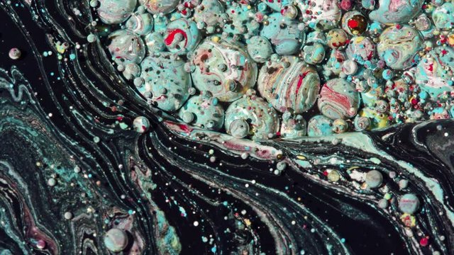 Top view Bright Collors Bubbles Slow Motion Oil Ink is fantastic structure of colorful chaotic motion bubbles stock video is a beautiful, unique, organic.