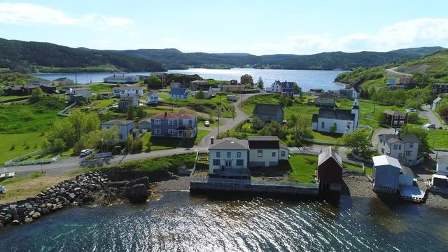 Aerial shot of car in historic trinity and the ocean coast in Newfoundland