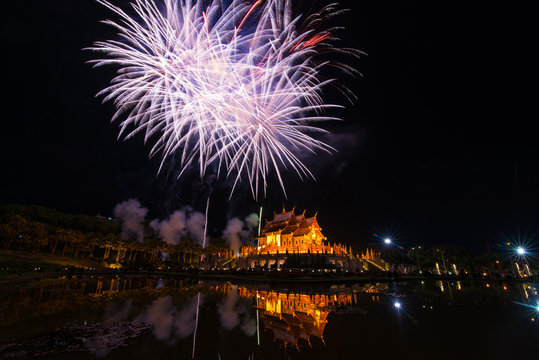 Fireworks celebrate the New Year 2018 at Rajapruek Royal Park, Chiang Mai with beutiful light of Hor Khum Luang temple,Thai Tradition Building