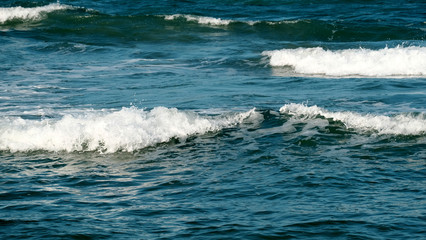Beach background / A beach is a land alongside a body of water which consists of loose particles. The particles composing a beach are typically made from rock, such as sand, gravel, shingle, pebbles