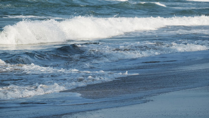 Beach background / A beach is a land alongside a body of water which consists of loose particles. The particles composing a beach are typically made from rock, such as sand, gravel, shingle, pebbles