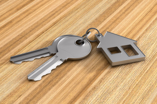 Two keys and trinket house on wooden surface. 3d illustration