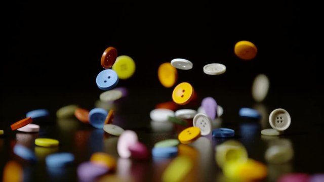 Colorful buttons falling, Ultra Slow Motion