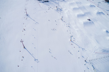 Aerial view of the skiing and snowboarding park in winter
