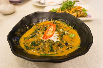 Close up traditional thai food red curry with Acasia