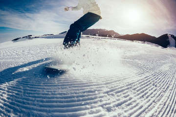 snowboarder snowboarding in winter mountains