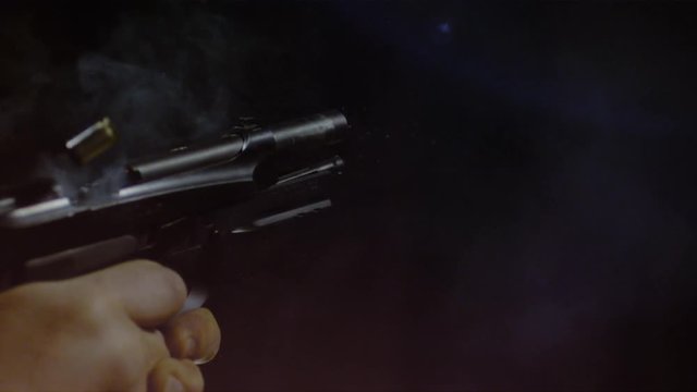 Close up of an automatic gun firing a bullet, Ultra Slow Motion