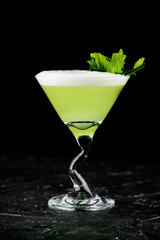 alcoholic beverage on a black background