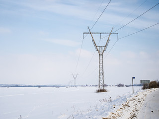 High voltage tower on a background of the winter sky. winter