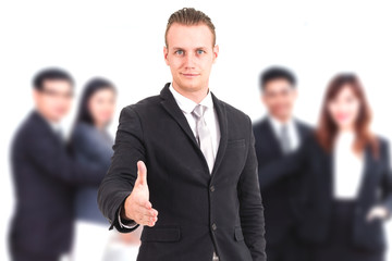 Businessman offering handshake on group of business  background