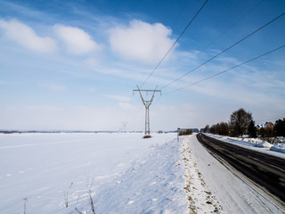 Fototapeta na wymiar High voltage tower on a background of the winter sky. winter