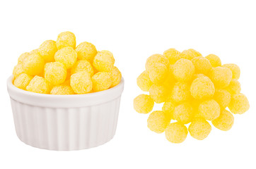 Set of yellow corn sticks balls as heap and in ceramics bowl isolated on white background. Fast food template for menu, advertising, cover.