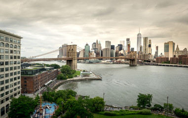 Brooklyn Bridge and New York City Skyline under Stormy Skies