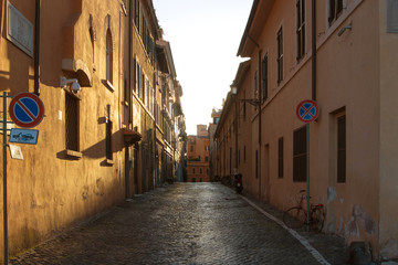 Fototapeta na wymiar View of old town italian narrow street in Trastevere Rome Italy.