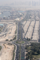 beautiful aerial view of futuristic city landscape with roads, cars and skyscrapers