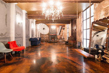 Loft interior with mirror, candles, brick wall, large window, living room, coffee table in modern design