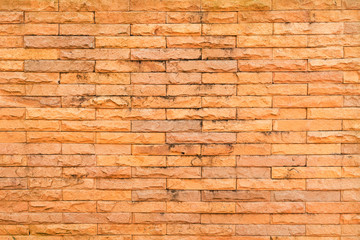 Old red brick stone wall texture and background.