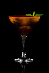 alcoholic cocktail on a black background with insulation