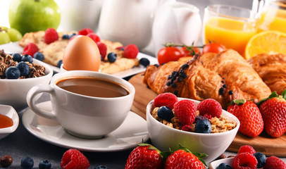 Breakfast served with coffee, juice, croissants and fruits