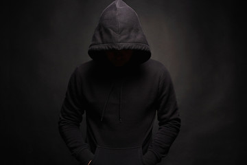 Fototapeta na wymiar Man in Hood. Dark figure