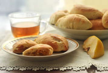 Homemade patties stuffed with apple or quince