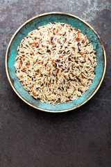 White, brown and black wild rice. Rice in bowl.