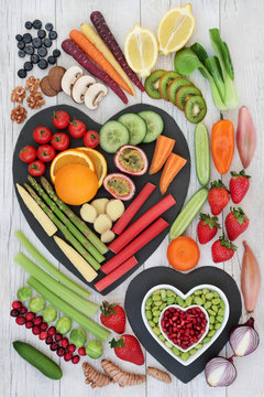 Super food for healthy life concept with fresh vegetables, fruit, nuts and spices with foods high in  anthocyanins, antioxidants, omega 3 fatty acids, dietary fibre, vitamins and minerals. Top view.