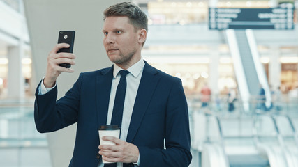 Young businessman with a phone