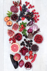 Healthy food with super health promoting properties with fruit and vegetables high in anthocyanins, minerals, antioxidants and vitamins. Foods in purple, red and blue colours denotes anthocyanin.  © marilyn barbone