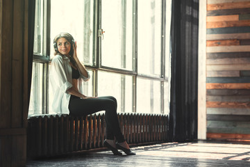 Fototapeta premium Young girl with headphones