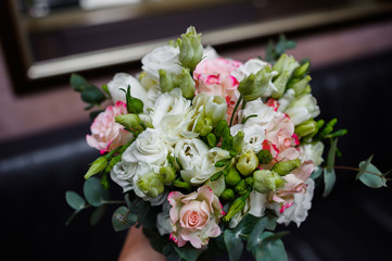 Bride holding wedding bouquet close up
