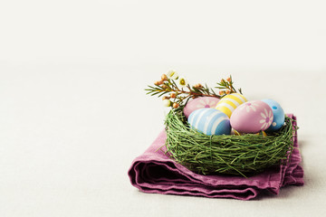 Colorful Easter eggs in nest