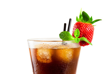 Glass of cold coffee or tea with ice cubes, strawberry and mint leaf on the white table