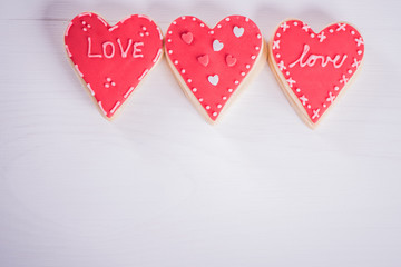 Obraz na płótnie Canvas hand made heart shape cookies valentine wedding concept on white background 