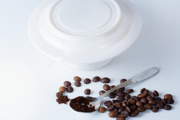 Coffee cup and beans on old kitchen table. Top view with copyspa