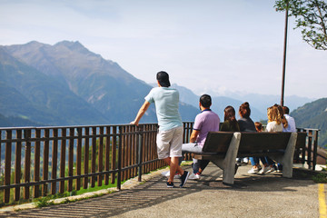 a group of people look and admire the surrounding nature