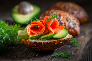 Spring bun with avocado, dill and salmon
