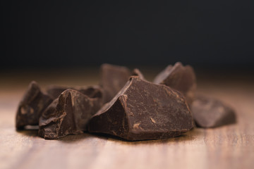 dark chocolate chunks on wood table