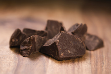 dark chocolate chunks on wood table