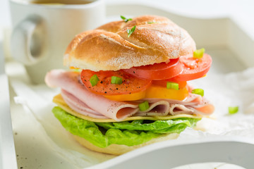 Big sandwich with fresh ingredients for breakfast