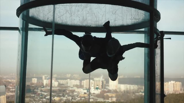 A group of persons trying the World's biggest free fall simulator, indoor skydiving Aero Gravity. Aerodynamic tube