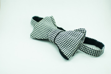 A stylish and well-designed white-black bow tie on a white background; isolated
