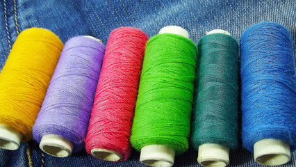 Blue jeans and sewing threads.