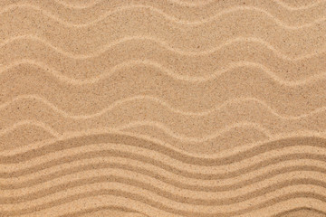 Fototapeta na wymiar Zigzag and sand dunes, sand texture, background.