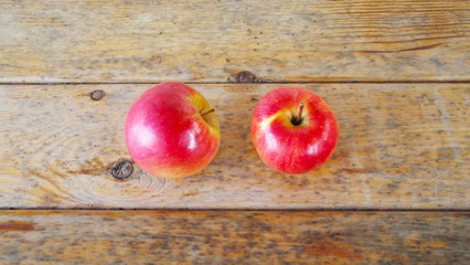 Fresh red Apple on wooden background.