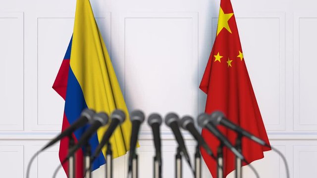 Flags of Colombia and China at international meeting or negotiations press conference