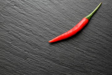 Red chili pepper on slate board