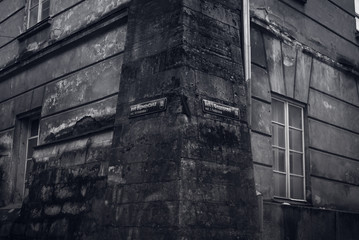 Corner of the street and old abandoned house in Lviv, Ukraine. Black and white