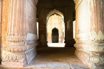 Pillars and arched gateway in the bara imambara lucknow in India. This perfect example of ancient mughal architecture is a famous tourist spot in India